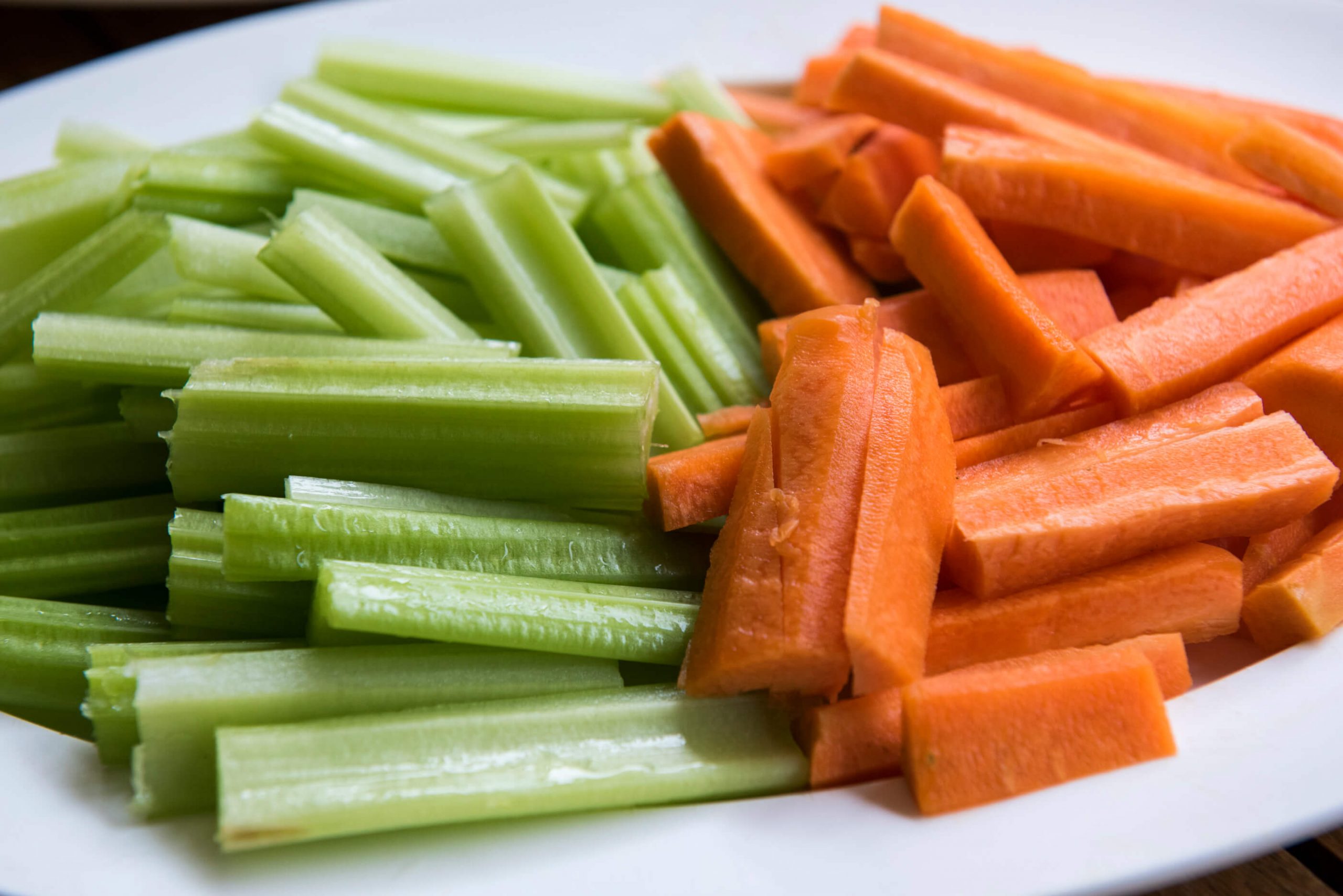 Carrot and celery sticks on plate